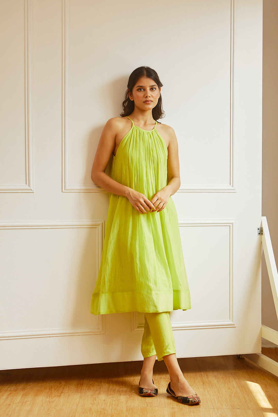 Juanita- Handwoven chanderi sleeveveless tunic dress with front gather paired with cotton trouser in fresh lime color