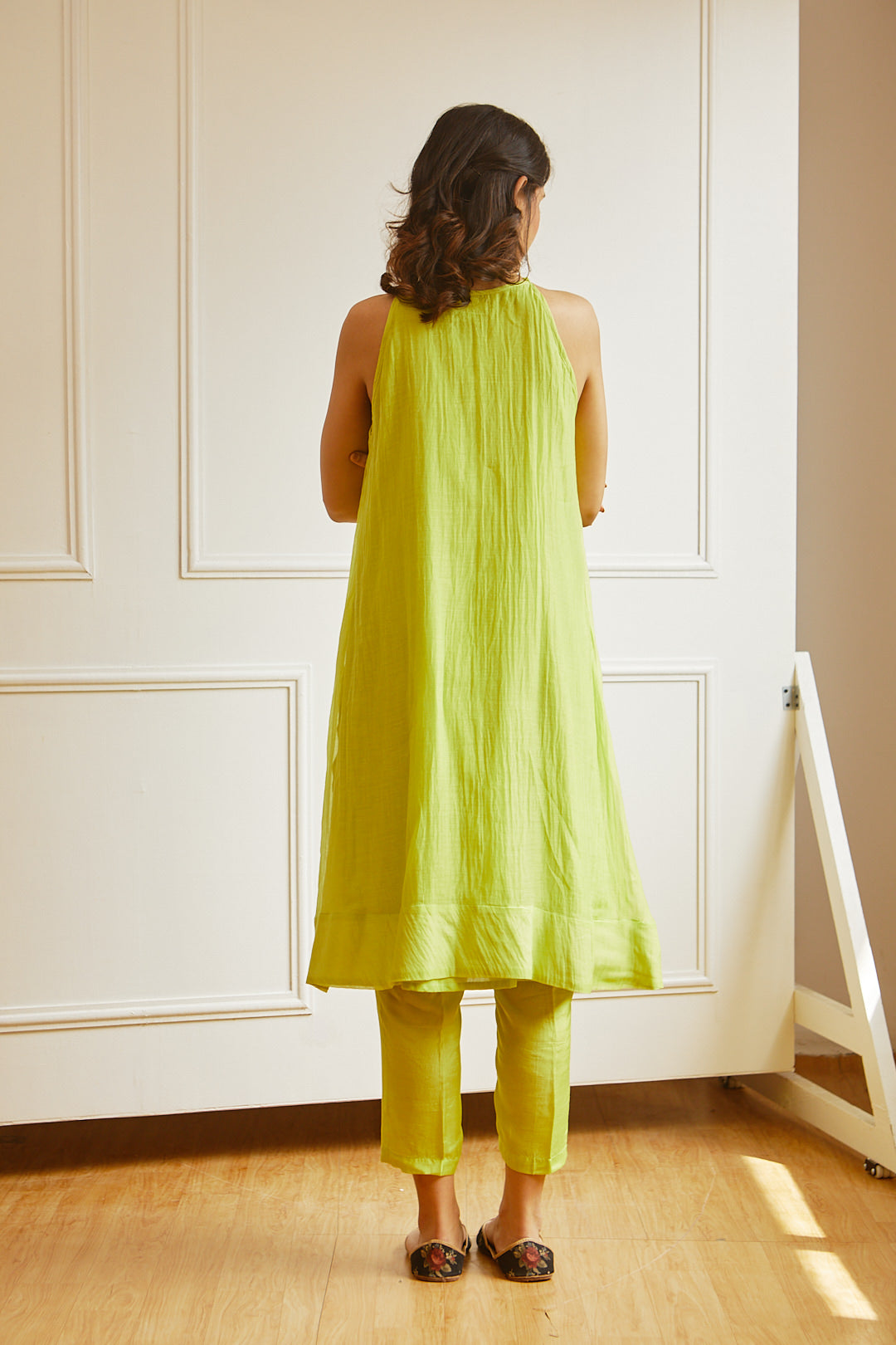 Juanita- Handwoven chanderi sleeveveless tunic dress with front gather paired with cotton trouser in fresh lime color